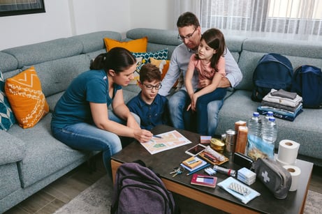 Adobe stock photo of family meeting with kids discussing back to school budget