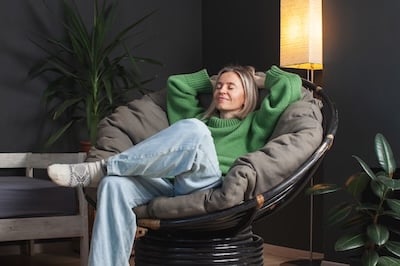 Happy middle aged Woman relaxing at home Adobe stock photo