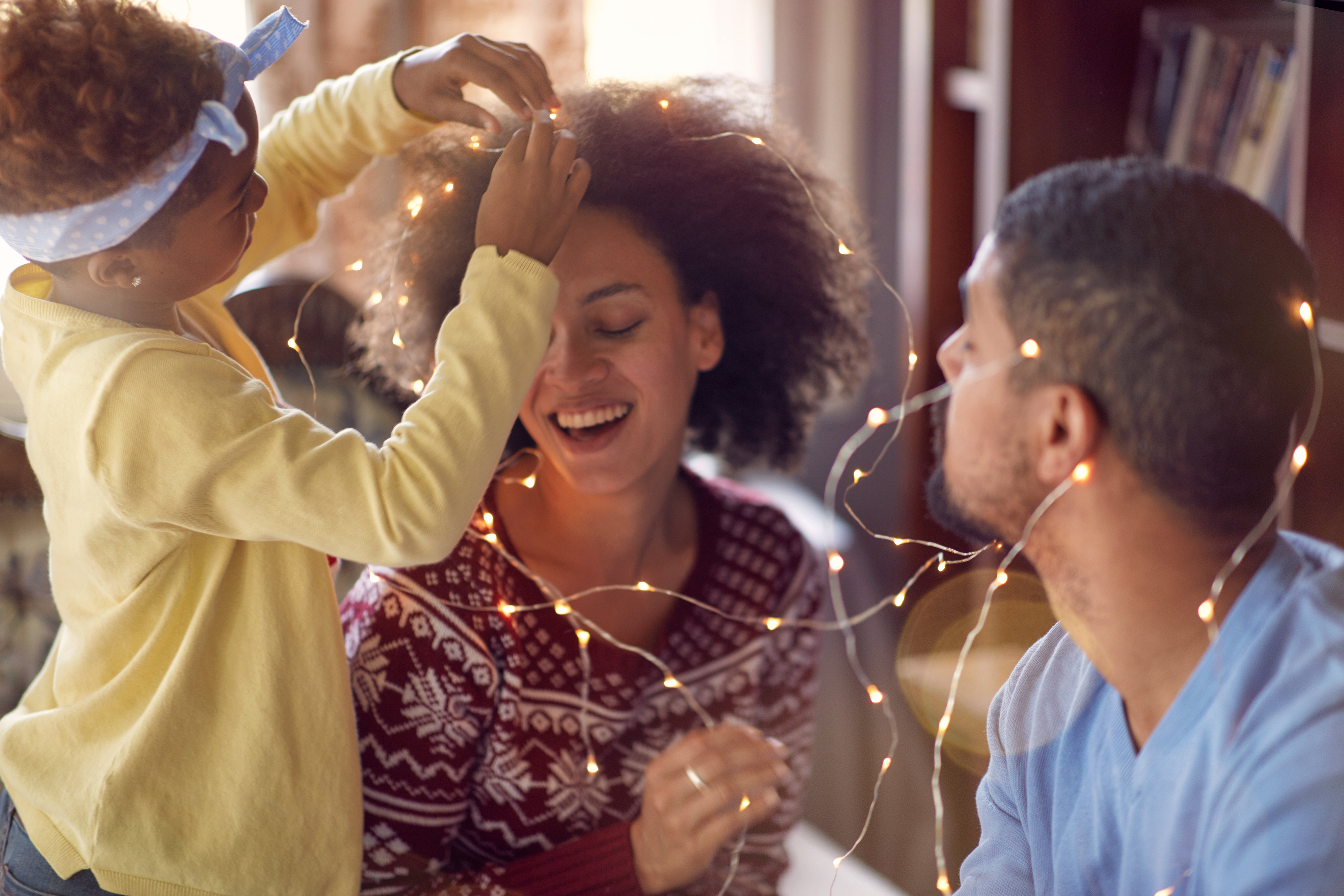 Beautiful young family enjoying their holiday time together Adobe stock photo