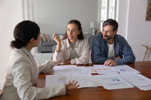 Spouses meeting female budget expert at home for personal consultation
