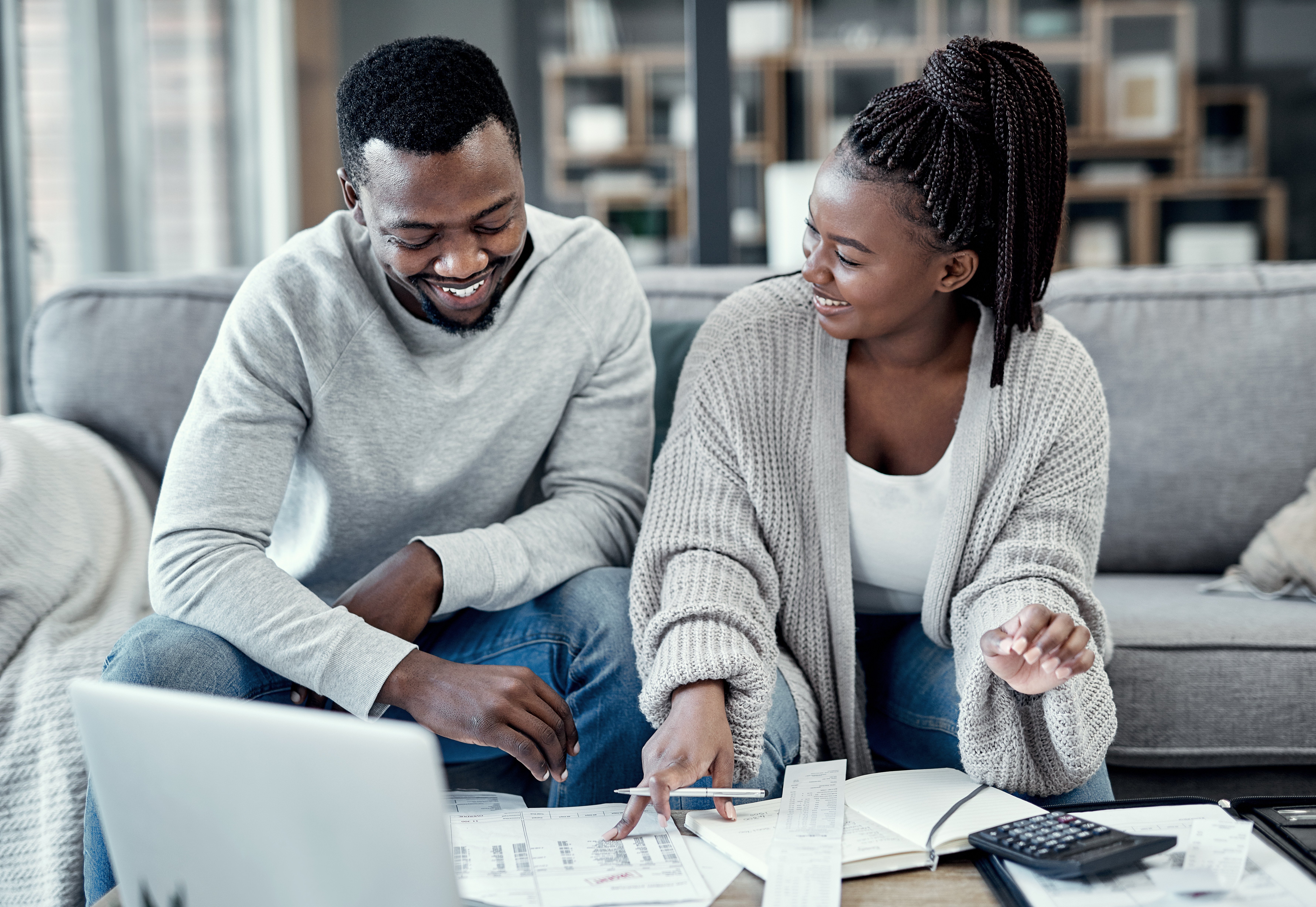 home budget and financial planning with a couple working on a laptop Adobe stock photo