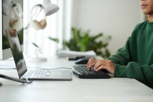 Working on Laptop in Bright Modern Office