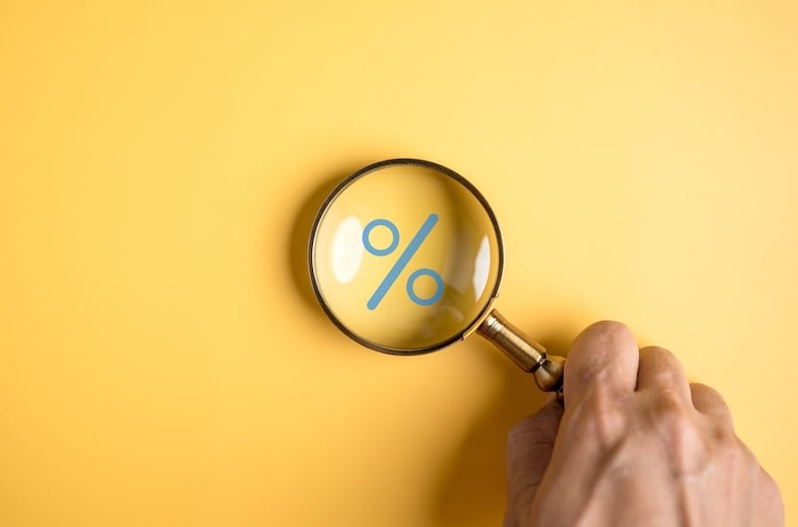 Percentage sign of Magnifier glass focus to percentage icon with percent symbol, interest rate and business profit growth concept.