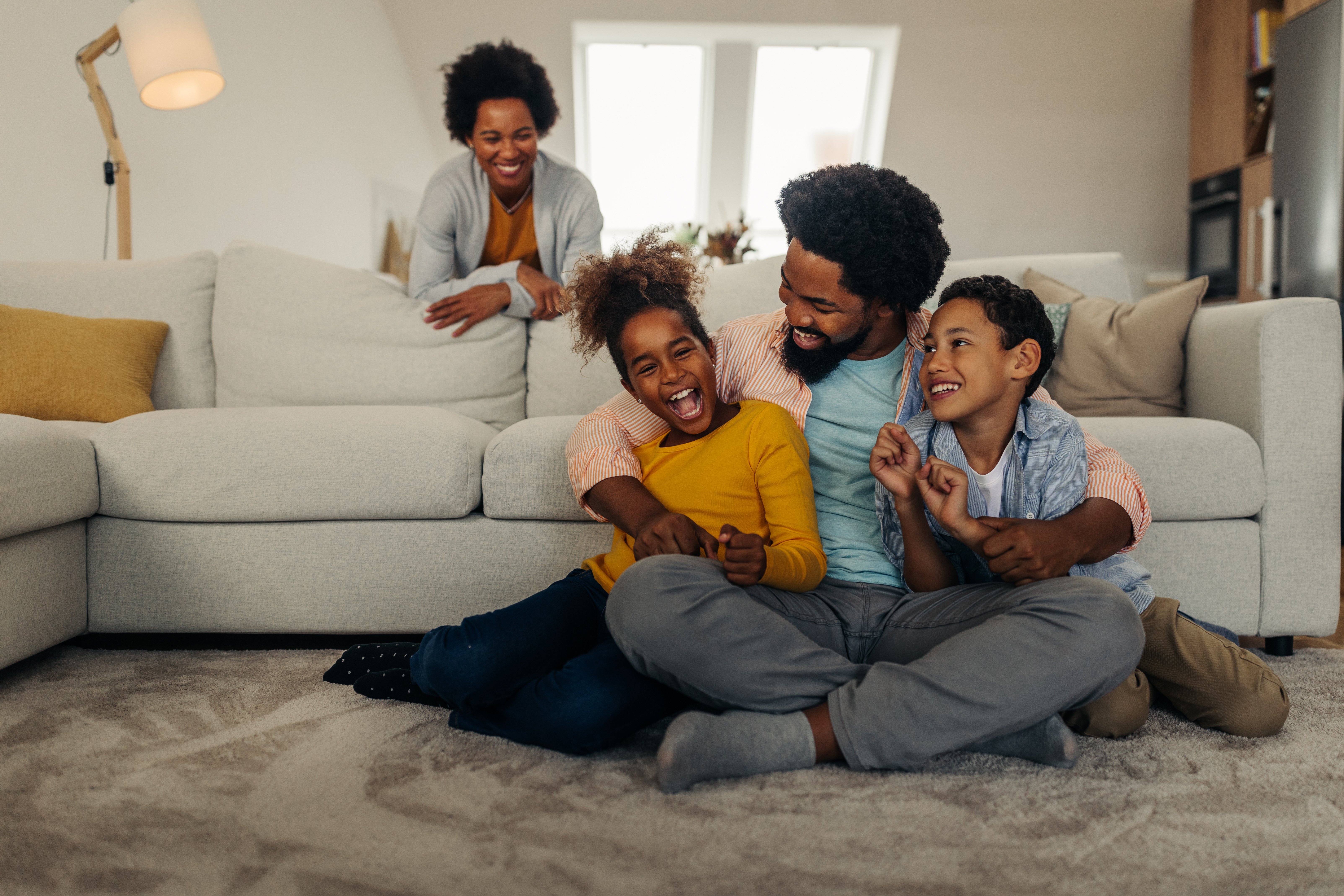 family in the living room Adobe stock photo