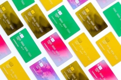 business with credit cards on office desk white background top view pattern